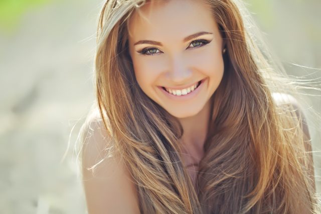Skin Treatments | Acne Treatments Canberra Woman smiling outside after receiving skin rejuvenation